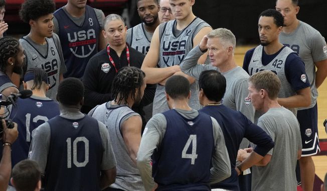 Head coach Steve Kerr of the Golden State Warriors motions as he speaks with his players at a practice during training camp for the United States men&#x27;s basketball team Thursday, Aug. 3, 2023, in Las Vegas. (AP Photo/John Locher)