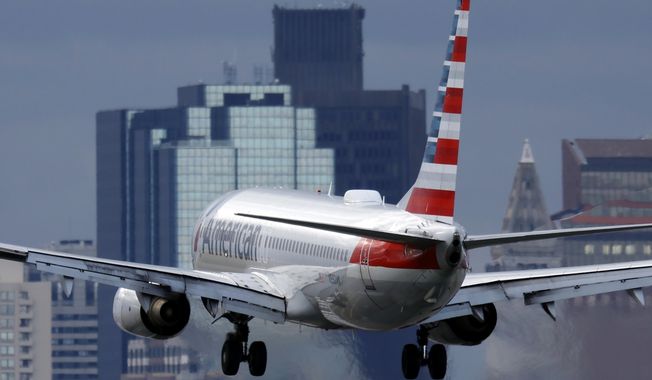 FILE - An American Airlines plane lands at Logan International Airport, Thursday, Jan. 26, 2023, in Boston. American Airlines said Thursday, Aug. 17, 2023, that it will start flying to three new destinations in Europe next summer — Copenhagen, Naples and Nice, France. (AP Photo/Michael Dwyer, File)