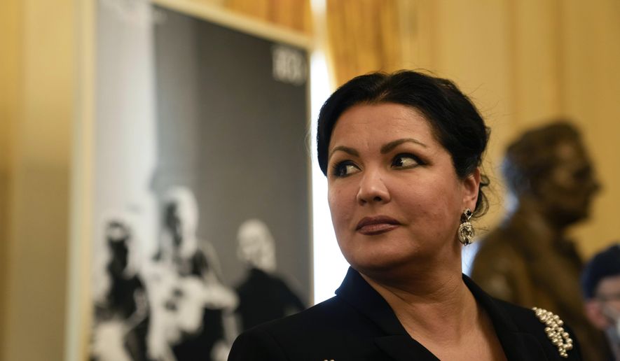 FILE - Russian soprano Anna Netrebko answers reporters' questions prior to the start of a news conference to present Giuseppe Verdi's 'Macbeth', directed by Italian conductor Riccardo Chailly, who will open the opera season at the La Scala opera house, in Milan, Italy, on Nov. 29, 2021. A scheduled performance by Russian opera singer Anna Netrebko in the Czech capital has been canceled, officials said on Thursday, Aug. 17, 2023. The announcement came after the Prague government said on Monday that all its coalition parties opposed the concert at a time Russia wages war on Ukraine. (AP Photo/Luca Bruno, File)