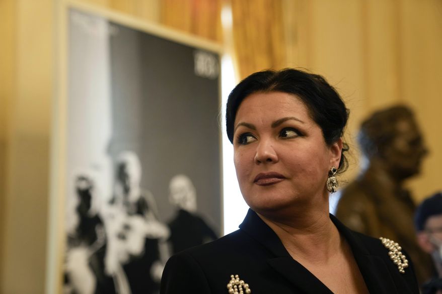FILE - Russian soprano Anna Netrebko answers reporters' questions prior to the start of a news conference to present Giuseppe Verdi's 'Macbeth', directed by Italian conductor Riccardo Chailly, who will open the opera season at the La Scala opera house, in Milan, Italy, on Nov. 29, 2021. A scheduled performance by Russian opera singer Anna Netrebko in the Czech capital has been canceled, officials said on Thursday, Aug. 17, 2023. The announcement came after the Prague government said on Monday that all its coalition parties opposed the concert at a time Russia wages war on Ukraine. (AP Photo/Luca Bruno, File)