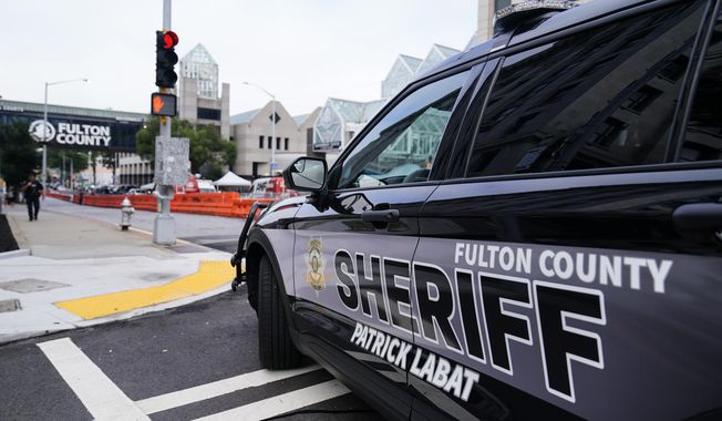 Barricades are seen near the Fulton County courthouse, Monday, Aug. 7, 2023, in Atlanta. The sheriff&#x27;s office are implementing various security measures ahead of District Attorney Fani Willis possibly seeking an indictment in her investigation into whether former President Donald Trump and his allies illegally meddled in the 2020 election in Georgia. (AP Photo/Brynn Anderson)