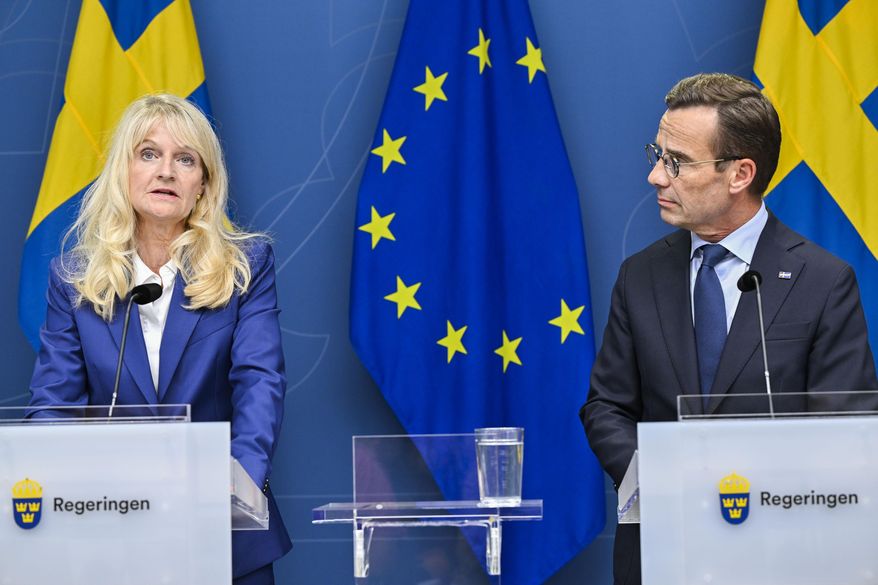 Sweden's Security Police Chief Charlotte von Essen, left, and Prime Minister Ulf Kristersson attend a news conference in Stockholm, Sweden, Thursday, Aug. 17, 2023. Sweden raised its terrorism alert level on Thursday one notch to the second-highest, following a recent string of public desecrations of the Quran in the Scandinavian country by a handful of anti-Islam activists, sparking angry demonstrations across Muslim countries. (Henrik Montgomery/TT News Agency via AP)