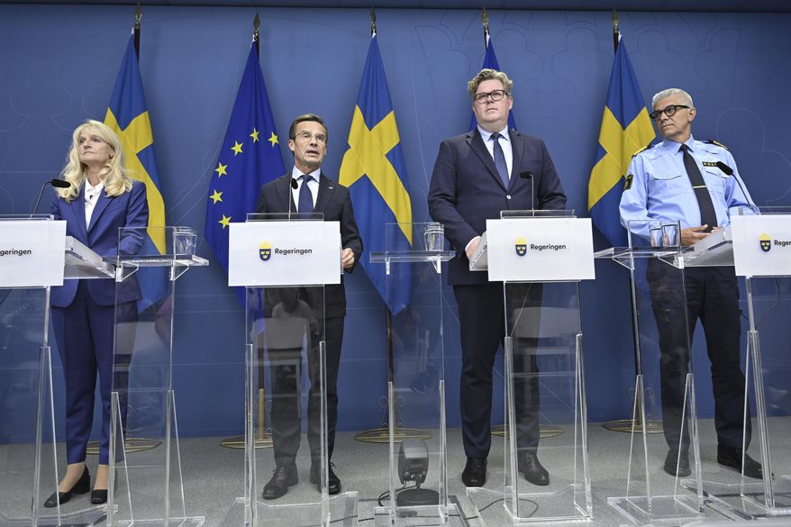 From left, Sweden's Security Police Chief Charlotte von Essen, Prime Minister Ulf Kristersson, Justice Minister Gunnar Strommer and National Police Commissioner Anders Thornberg attend a news conference in Stockholm, Sweden, Thursday, Aug. 17, 2023. Sweden raised its terrorism alert level on Thursday one notch to the second-highest, following a recent string of public desecrations of the Quran in the Scandinavian country by a handful of anti-Islam activists, sparking angry demonstrations across Muslim countries. (Henrik Montgomery/TT News Agency via AP)