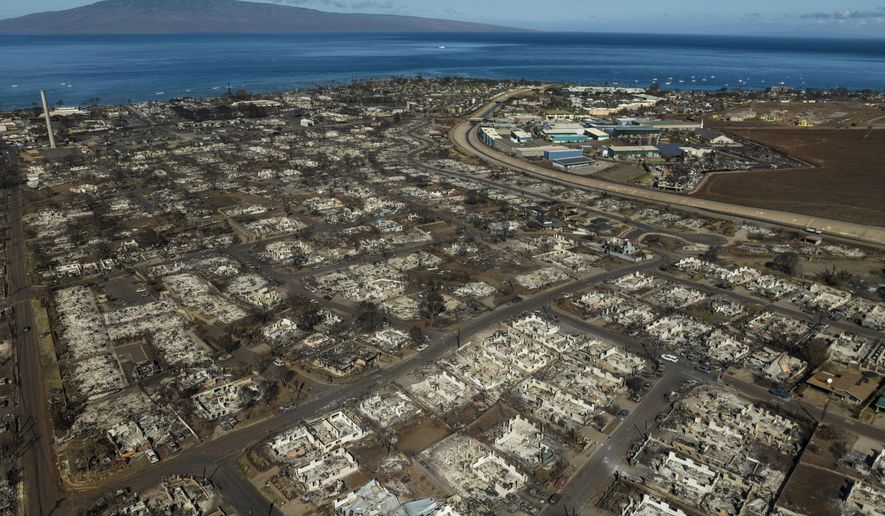 FILE - The aftermath of a wildfire is visible in Lahaina, Hawaii, Aug. 17, 2023. When the most deadly U.S. fire in a century ripped across the Hawaiian island, it damaged hundreds of drinking water pipes, resulting in a loss of pressure that likely allowed toxic chemicals along with metals and bacteria into water lines. Experts are using strong language to warn Maui residents in Lahaina and Upper Kula not to filter their own tap water. (AP Photo/Jae C. Hong, File)