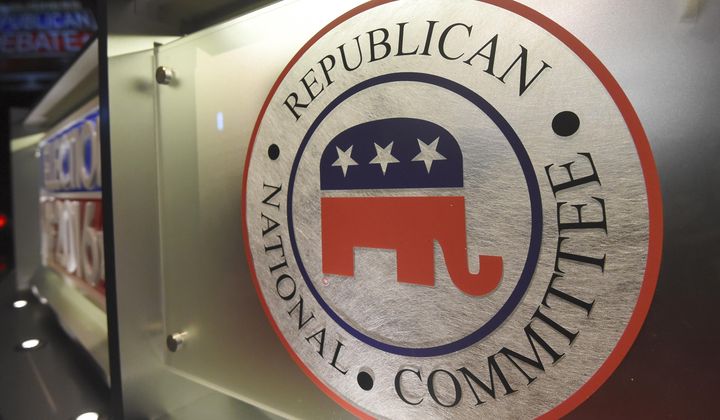 The Republican National Committee logo is shown on the stage as crew members work at the North Charleston Coliseum, on Jan. 13, 2016, in North Charleston, S.C. (AP Photo/Rainier Ehrhardt, File)