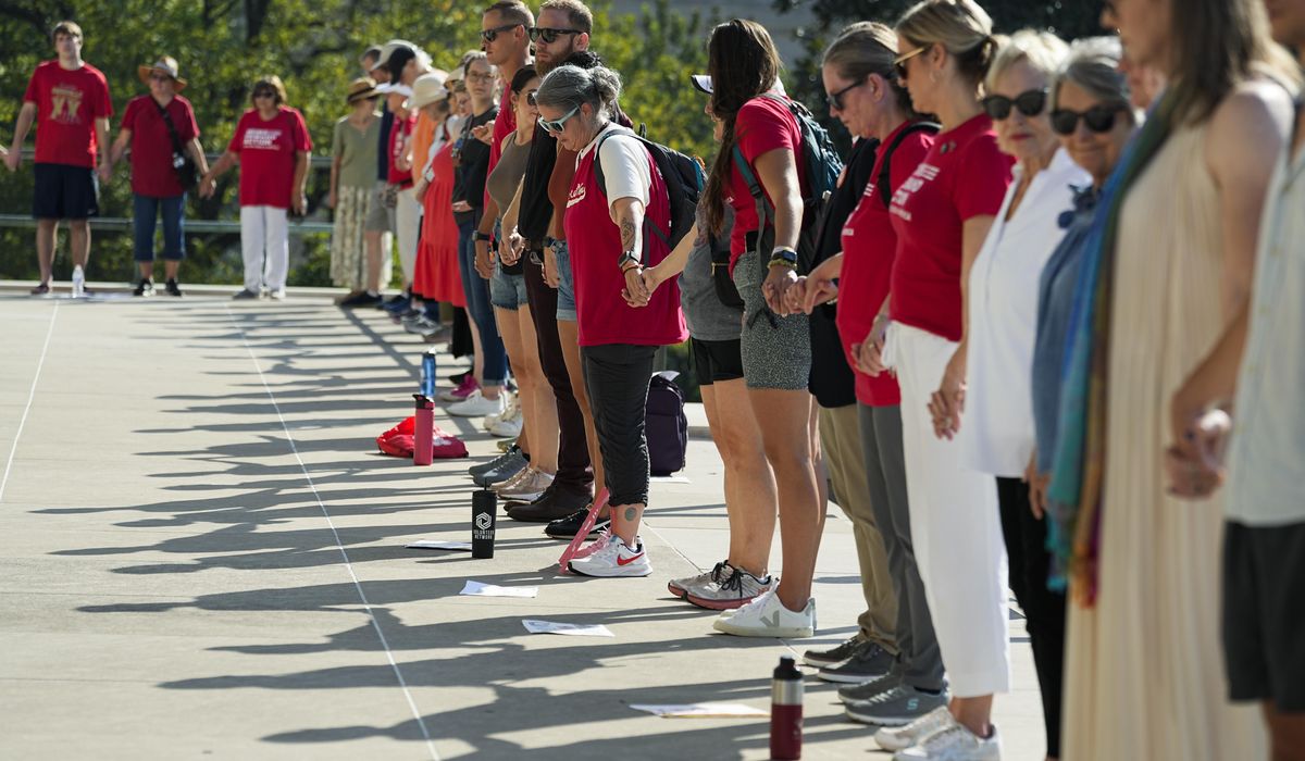 NextImg:Mass shootings spur divergent laws as states split between gun rights and control