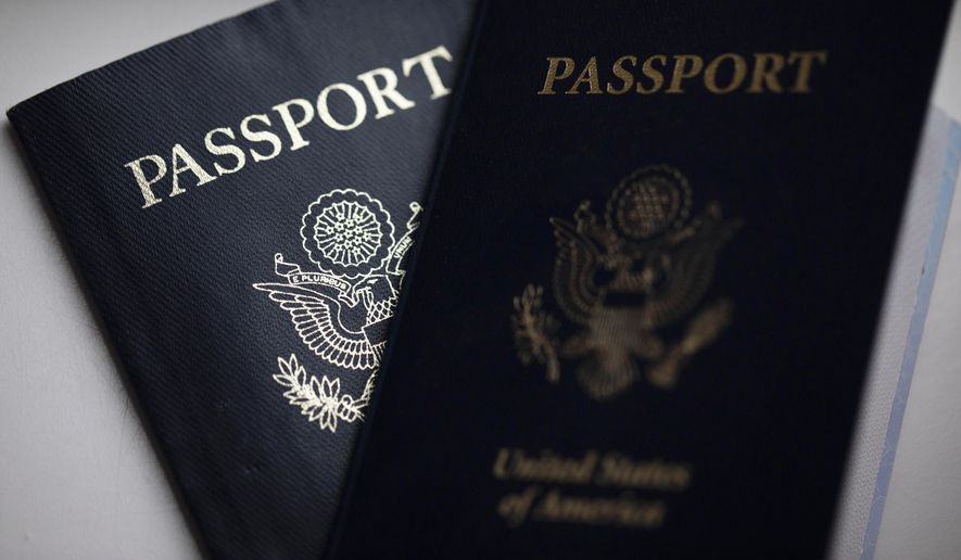 The cover of a U.S. Passport is displayed in Tigard, Ore., Dec. 11, 2021. The Biden administration is extending for another year a ban on the use of U.S. passports for travel to North Korea, the State Department said Tuesday, Aug. 22, 2023. The ban was imposed in 2017 and has been renewed every year since. (AP Photo/Jenny Kane, File)