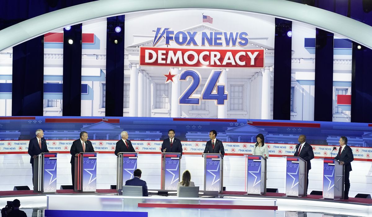 NextImg:Republicans brawl at first debate without Trump