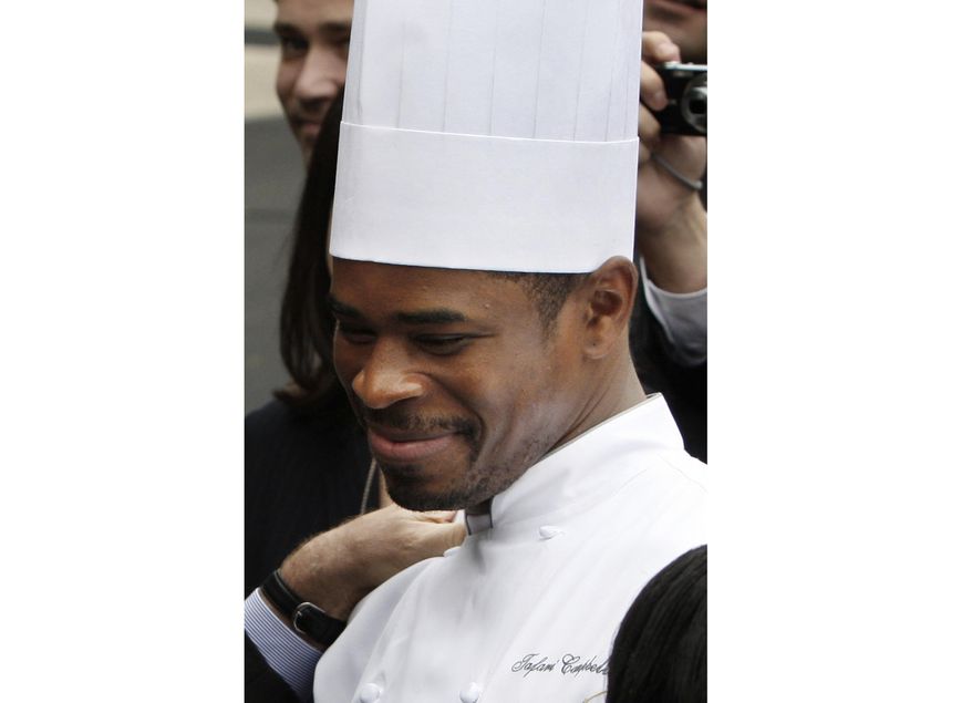 White House Chef Tafari Campbell smiles, Nov. 6, 2008, on the South Lawn of the White House in Washington. The drowning death of former President Barack Obama’s personal chef near the family’s home on Martha’s Vineyard on July 24, 2023, was ruled an accident by the Massachusetts medical examiner on Wednesday, Aug. 23. (AP Photo/Ron Edmonds, File)