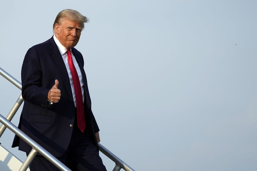 Former President Donald Trump steps off his plane as he arrives at Hartsfield-Jackson Atlanta International Airport, Thursday, Aug. 24, 2023, in Atlanta. (AP Photo/Alex Brandon)