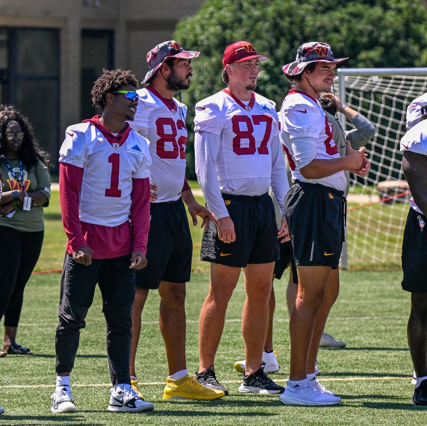 Suitland, MD - The Washington Commanders hosted a walk-through practice at Joint Base Andrews. After the practice, the players interacted with the on-site military personnel, their families, and friends. (Joe Glorioso | All-Pro Reels)