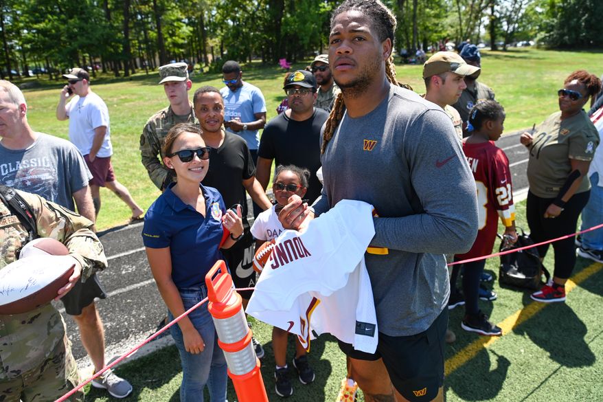 Suitland, MD - The Washington Commanders hosted a walk-through practice at Joint Base Andrews. After the practice, the players interacted with the on-site military personnel, their families, and friends. (Joe Glorioso | All-Pro Reels)