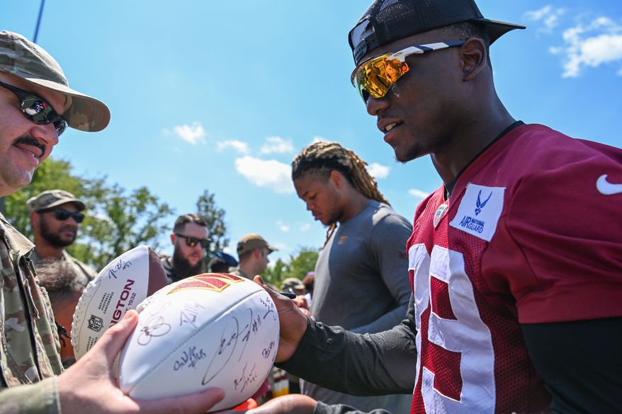 Suitland, MD - The Washington Commanders hosted a walk-through practice at Joint Base Andrews. After the practice, the players interacted with the on-site military personnel, their families, and friends. (Joe Glorioso | All-Pro Reels)