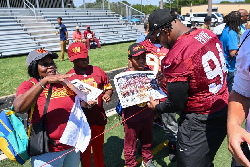 Suitland, MD - The Washington Commanders hosted a walk-through practice at Joint Base Andrews. After the practice, the players interacted with the on-site military personnel, their families, and friends. (Joe Glorioso | All-Pro Reels)