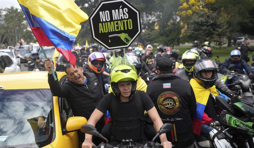 Motorcycle riders hold a caravan to protest the increase in gas prices in Bogota, Colombia, Monday, Aug. 28, 2023. (AP Photo/Fernando Vergara)