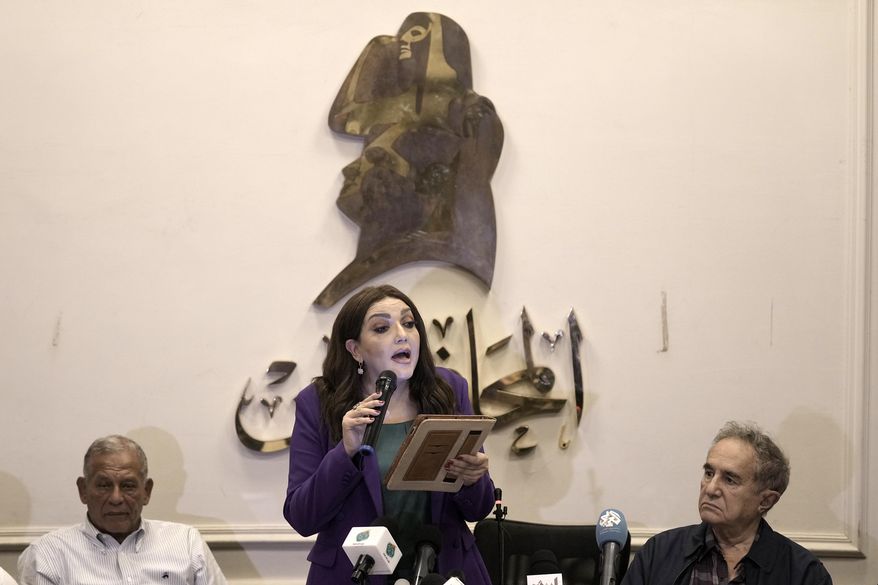 Gameela Ismail, center, the head of Egypt's al-Dostour Party, speaks during a presser held by the Free Current coalition in Cairo, Egypt, Monday, Aug. 28, 2023. A new coalition of Egyptian political parties has publicly criticized the country's current government on Monday for persecuting politicians. In a presser Monday a spokesmen for the coalition said the practices of the current government are a danger to the country's future. (AP Photo/Amr Nabil)