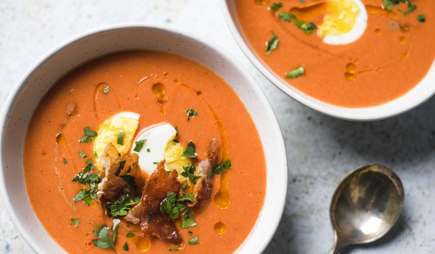 This image released by Milk Street shows a recipe for Andalusian tomato and bread soup. (Milk Street via AP)