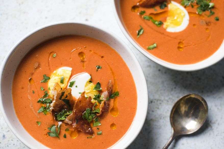 This image released by Milk Street shows a recipe for Andalusian tomato and bread soup. (Milk Street via AP)
