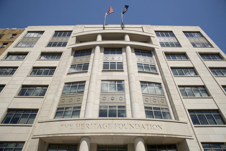 FILE - The Heritage Foundation building is seen on Aug. 5, 2017, in Washington. With more than a year to go before the 2024 election, a constellation of conservative organizations is preparing for a possible second White House term for Donald Trump, recruiting thousands of Americans to come to Washington on a mission to dismantle the federal government and replace it with a vision closer to his own. (AP Andrew Harnik, File)