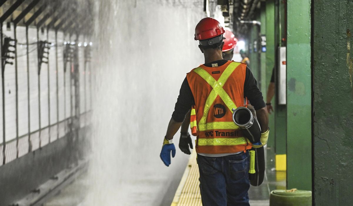 NextImg:New York City streets, subway flood as 127-year-old water main breaks under Times Square