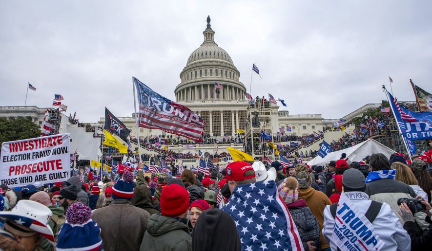 FILE - Rioters loyal to President Donald Trump at the U.S. Capitol in Washington, Jan. 6, 2021. (AP Photo/Jose Luis Magana, File)