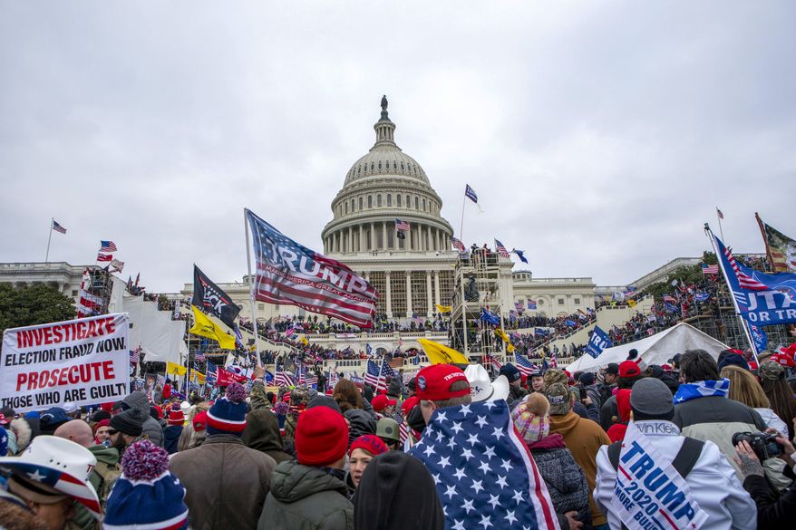 FILE - Rioters loyal to President Donald Trump at the U.S. Capitol in Washington, Jan. 6, 2021. (AP Photo/Jose Luis Magana, File)