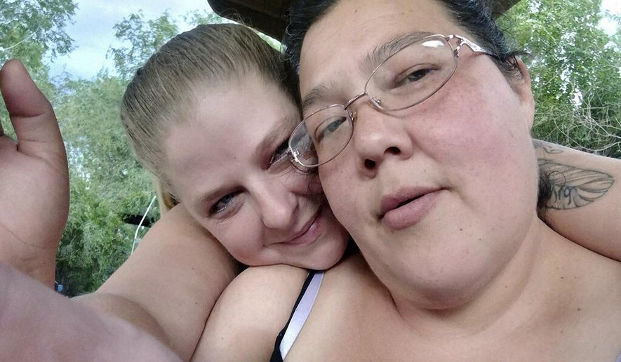 This selfie photo provided by Trevala Jara shows Trevala Jara, left, and Christine Vance posing for a photo together in July 2022 in Colorado. Vance left with her sister and nephew to try and live off the grid at a remote campsite in Colorado’s Rocky Mountains. (Trevala Jara via AP)