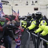 Rioters loyal to President Donald Trump clash with police at the U.S. Capitol on Jan. 6, 2021, in Washington. Liberal groups are trying to end Trump's attempt to return to the White House by arguing that he is no longer eligible to be president after trying to overturn the 2020 election results.(AP Photo/John Minchillo, File)