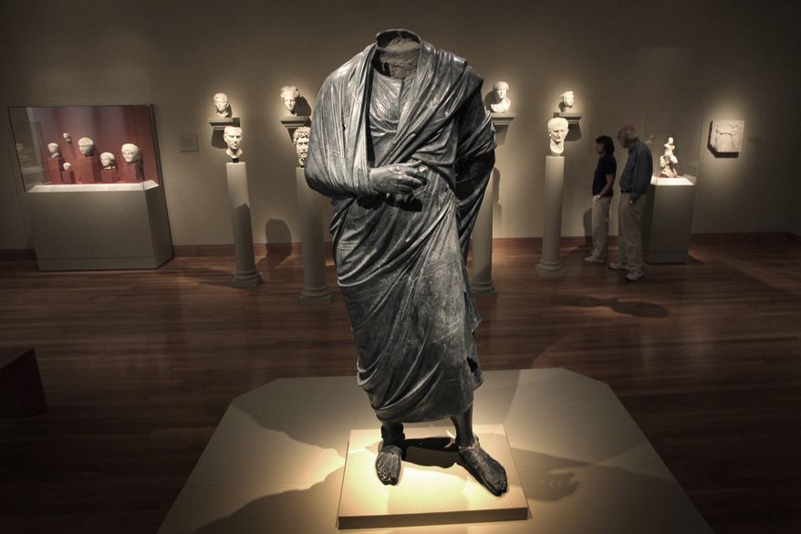 The Emperor as Philosopher," a Roman-era statue, thought to represent Marcus Aurelius, stands in a gallery at the Cleveland Museum of Art in Cleveland, Ohio, June 25, 2010. A warrant signed by a judge in Manhattan, Aug. 14, 2023, ordered the seizure of the statue, from the Cleveland Museum of Art by New York authorities investigating antiquities looted from Turkey. (AP Photo/Amy Sancetta, File)