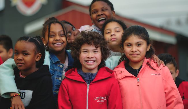 Elementary school students pose while attending LifeWise Academy released time Bible class. Though permitted under a 1952 Supreme Court ruling, the Freedom From Religion Foundation, an atheist group, objects to the classes and sent letters to more than 600 Ohio school districts protesting the program.