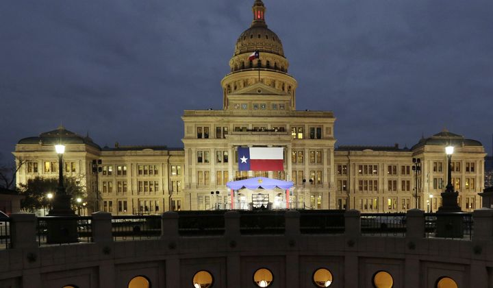 In this Jan. 14, 2019 file photo, a large Texas flag hangs from the Texas State Capitol in Austin, Texas. The Supreme Court refused Tuesday to block a lower court order siding with Texas over its law aimed at requiring age verification to view pornographic websites. (AP Photo/Eric Gay, File)
