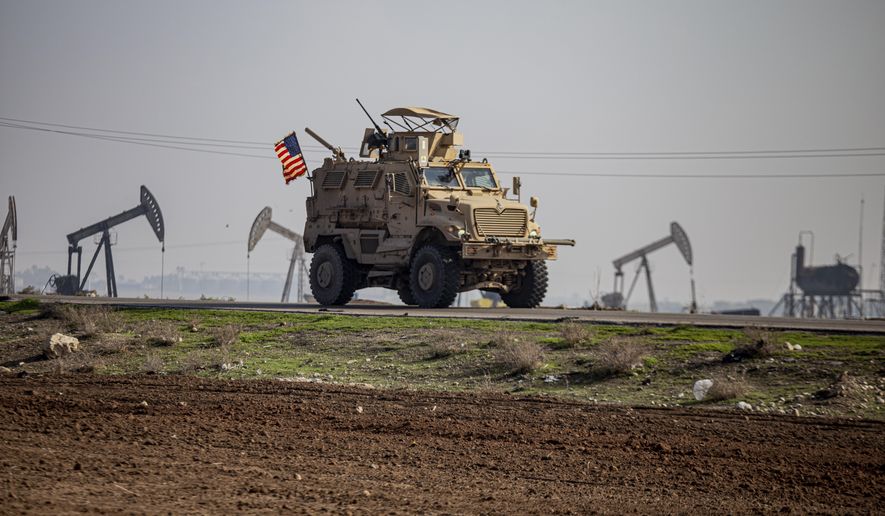 FILE - A US military vehicle on a patrol in the countryside near the town of Qamishli, Syria, on Dec. 4, 2022. Syria&#x27;s U.S.-backed and Kurdish-led forces on Tuesday, Sept. 5, 2023 pushed deeper into the last stronghold of Arab tribesmen who have taken up arms against them in eastern Syria as a spokesperson said they hoped to end the dayslong clashes there in the “next 24 hours.” (AP Photo/Baderkhan Ahmad, File)