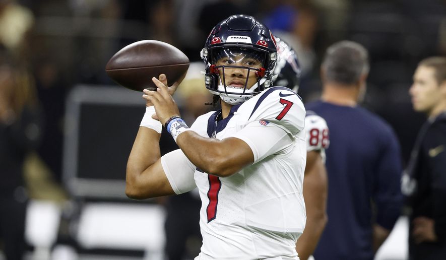 Houston Texans quarterback C.J. Stroud warms up before a preseason NFL football game against the New Orleans Saints, Sunday, Aug. 27, 2023, in New Orleans. (AP Photo/Butch Dill)