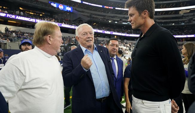 Las Vegas Raiders owner Mark Davis, left, Dallas Cowboys owner Jerry Jones, center, and former player Tom Brady, right, talk on the sideline before a preseason NFL football game between the two teams in Arlington, Texas, Saturday, Aug. 26, 2023. (AP Photo/Sam Hodde)