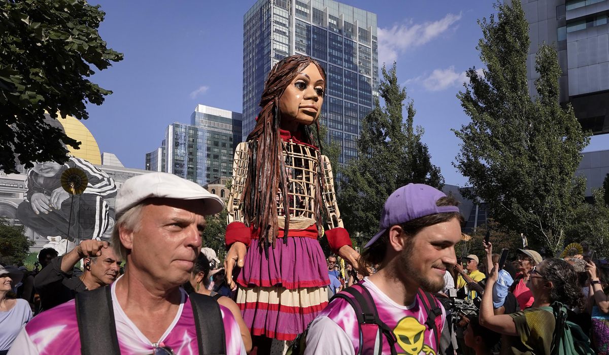 NextImg:Little Amal, a 12-foot puppet of a Syrian refugee, began its journey across the U.S. in Boston