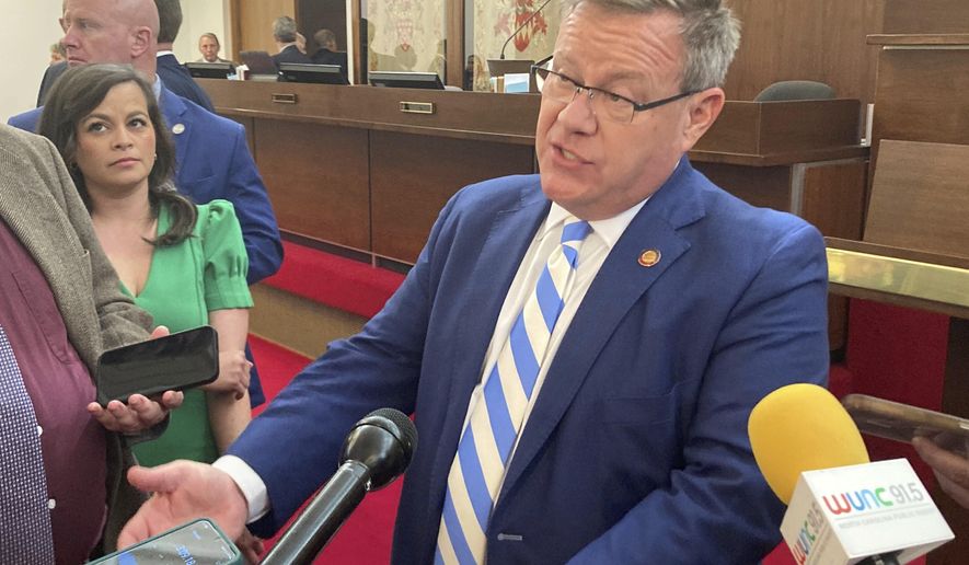 North Carolina House Speaker Tim Moore, R-Cleveland, speaks with reporters on the House floor of the Legislative Building in Raleigh, N.C., on Tuesday, Sept. 5, 2023. Moore talked about a private meeting of House Republicans earlier Tuesday in which he said they spoke about potential state budget provisions to expand gambling in the state. (AP Photo/Gary D. Robertson).