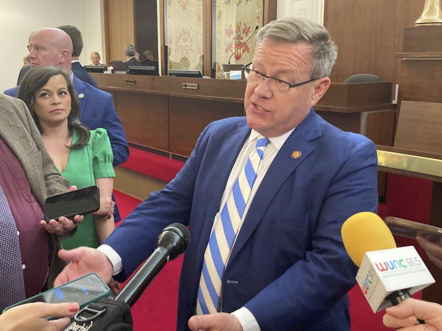 North Carolina House Speaker Tim Moore, R-Cleveland, speaks with reporters on the House floor of the Legislative Building in Raleigh, N.C., on Tuesday, Sept. 5, 2023. Moore talked about a private meeting of House Republicans earlier Tuesday in which he said they spoke about potential state budget provisions to expand gambling in the state. (AP Photo/Gary D. Robertson).