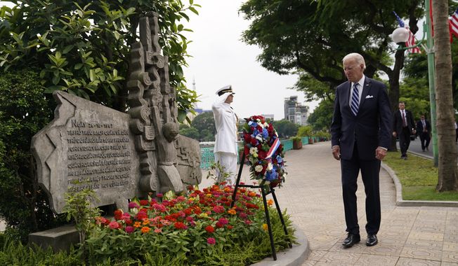 U.S. President Joe Biden visits John Sidney McCain III Memorial in Hanoi, Vietnam, Monday, Sept. 11, 2023. (AP Photo/Evan Vucci)