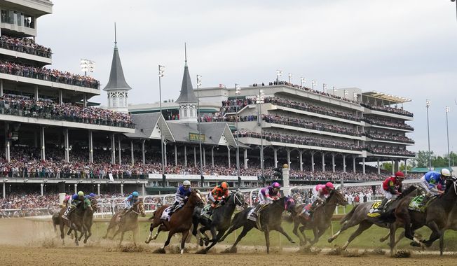 FILE - Javier Castellano, atop Mage, third from left, is seen with others behind the pack as they make the first turn while competing in the 149th running of the Kentucky Derby horse race at Churchill Downs Saturday, May 6, 2023, in Louisville, Ky. Horse racing&#x27;s federally created oversight panel found no single cause of death among 12 horses at Churchill Downs this spring, but recommends further action and analysis to mitigate risk at the home of the Kentucky Derby, according to a report released Tuesday, Sept. 12. (AP Photo/Julio Cortez, File)