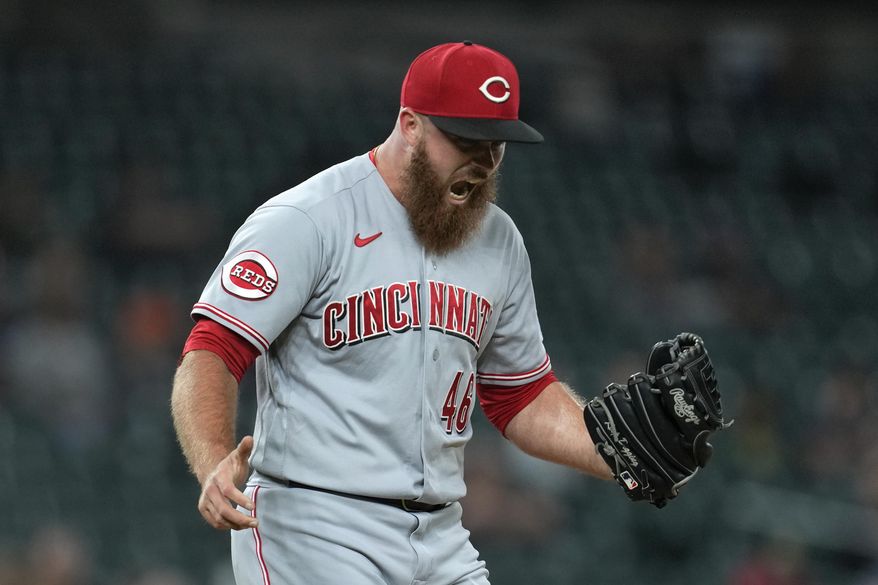 Cincinnati Reds relief pitcher Buck Farmer reacts to the final out against the Detroit Tigers in the 10th inning of a baseball game, Tuesday, Sept. 12, 2023, in Detroit. (AP Photo/Paul Sancya)