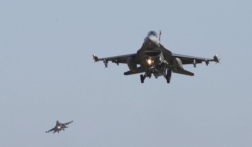 U.S. Air Force F-16 fighter jets fly over the Osan U.S. Air Base during a combined air force exercise with the United States and South Korea in Pyeongtaek, South Korea, Dec. 4, 2017. (AP Photo/Ahn Young-joon) ** FILE **