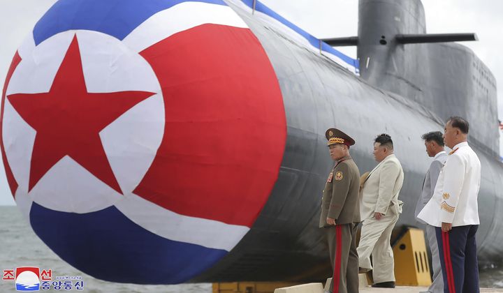 In this photo provided by the North Korean government, North Korean leader Kim Jong Un, second left, looks at what it says is a new nuclear attack submarine &quot;Hero Kim Kun Ok&quot; at an unspecified place in North Korea on Sept. 6, 2023. Independent journalists were not given access to cover the event depicted in this image distributed by the North Korean government. The content of this image is as provided and cannot be independently verified. The Korean language watermark on the image as provided by the source reads: &quot;KCNA&quot; which is the abbreviation for Korean Central News Agency. (Korean Central News Agency/Korea News Service via AP, File)