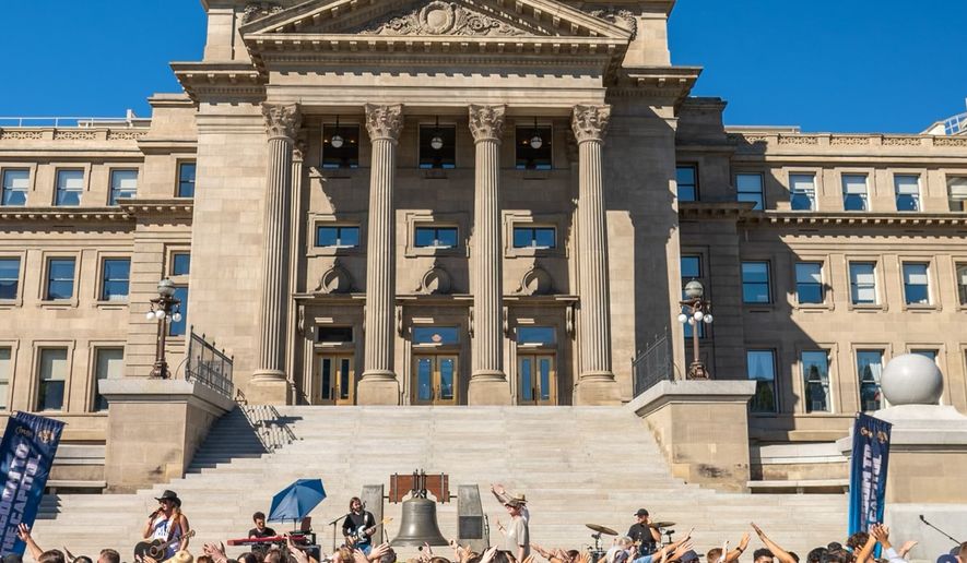 Attendees of the Let Us Worship service as part of the Kingdom to the Capitol tour pray and sing outside the State Capitol building in Boise, Idaho in July 2023. Courtesy of Gabriel Craig/Let Us Worship.