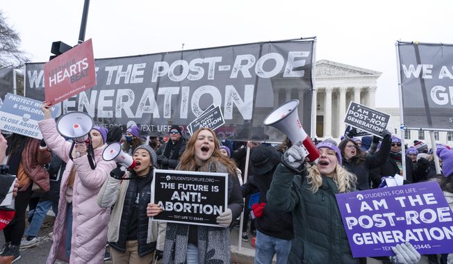 Anti-abortion activists march outside of the U.S. Supreme Court during the annual March for Life in Washington, Friday, Jan. 21, 2022. Donald Trump is dominating the early stages of the Republican presidential primary even as he’s refused to endorse a federal ban on abortion. That&#x27;s allowed some top rivals to get to the right of him on one of the issues that most animates conservative activists. (AP Photo/Jose Luis Magana) **FILE**