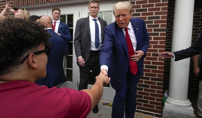 Former President Donald Trump visits the Alpha Gamma Rho, an agricultural fraternity, at Iowa State University before an NCAA college football game between Iowa State and Iowa, Saturday, Sept. 9, 2023, in Ames, Iowa. (AP Photo/Charlie Neibergall) **FILE**
