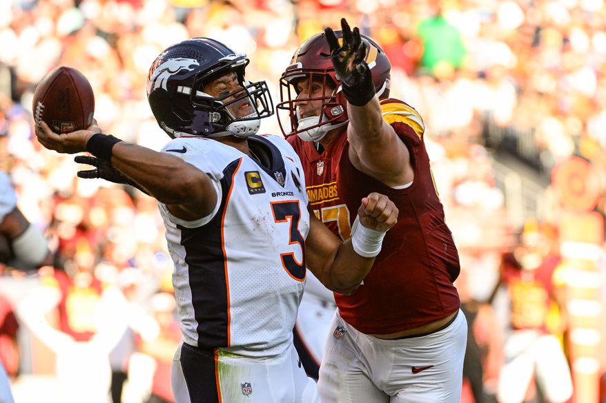 Washington Commanders linebacker Cody Barton (57) pressures Denver Broncos quarterback Russell Wilson (3) at Empower Field at Mile High, Denver, Colorado, September 17, 2023. (Photo by Brian Murphy for the Washington Times)