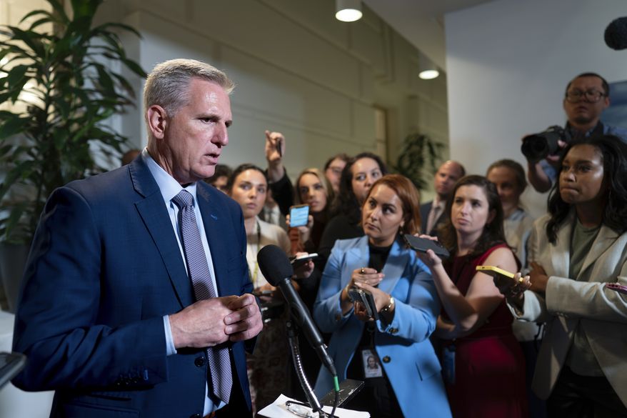 Speaker of the House Kevin McCarthy, R-Calif., briefs reporters following a closed-door Republican Conference meeting on how to agree on a path to funding the government, at the Capitol in Washington, Tuesday, Sept. 19, 2023. House Republican leaders have still been unable to pass next year's appropriations bills on the floor due to GOP infighting. (AP Photo/J. Scott Applewhite)