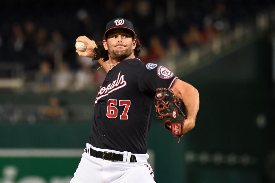 Washington Nationals relief pitcher Kyle Finnegan (67) throwing a pitch during the ninth inning of an MLB game against the Chicago White Sox at Nationals Park in Washington D.C., September 19, 2023. (Photo by Billy Sabatini/All-Pro Reels)