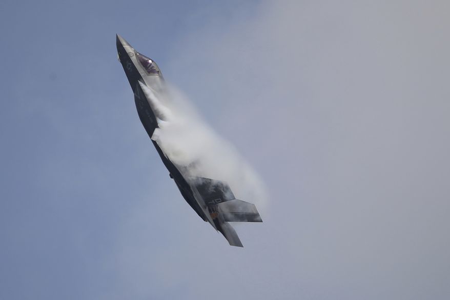 A U.S. Marine Corps F-35B Lightning II takes part in an aerial display during the Singapore Airshow 2022 at Changi Exhibition Centre in Singapore, on Feb. 15, 2022. The crash of an F-35B Joint Strike Fighter aircraft in South Carolina over the weekend has raised numerous questions about what prompted the pilot to eject after experiencing a malfunction and how the $100 million warplane was able to keep flying pilotless for 60 miles before crashing. (AP Photo/Suhaimi Abdullah, File)