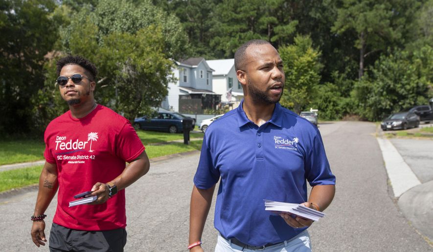 State Rep. Deon Tedder, D-North Charleston, right, canvasses with his team for the District 42 election in North Charleston, SC, on Saturday, Aug. 26, 2023. Tedder has won the Democratic nomination for an open South Carolina Senate seat by 11 votes, Thursday, Sept. 22. The South Carolina Election Commission certified the runoff results after a recount and the review of 10 disputed ballots. (Daniel Sarch/The Post And Courier via AP)